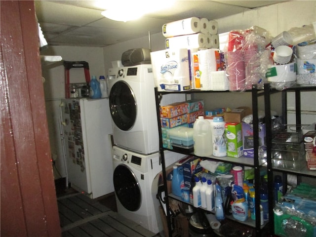 washroom featuring stacked washer and dryer