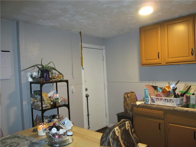 interior space with a textured ceiling