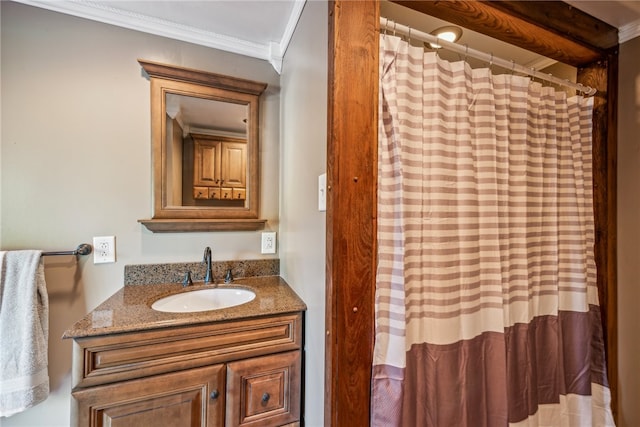 bathroom with vanity, ornamental molding, and curtained shower