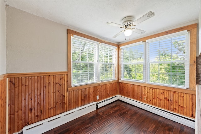 unfurnished sunroom featuring ceiling fan