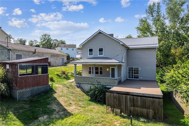 rear view of house with a lawn