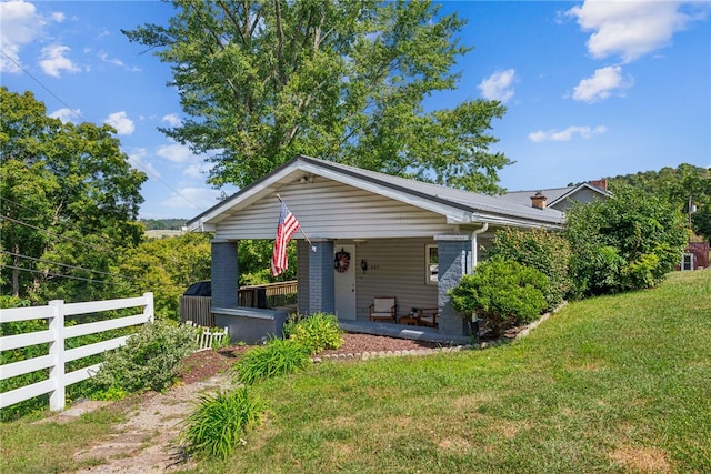 bungalow-style house with a front yard