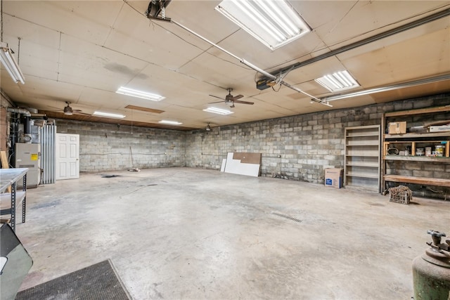 garage featuring a garage door opener and ceiling fan