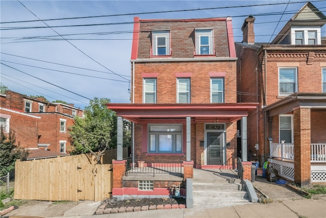 view of property featuring covered porch