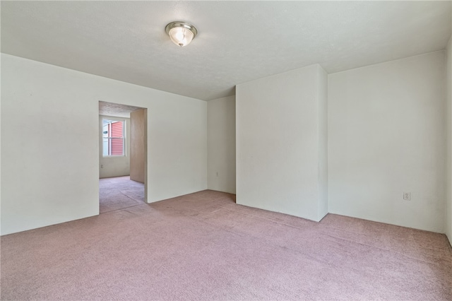 empty room featuring light carpet