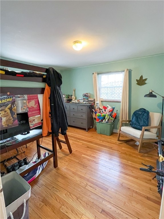 bedroom with light hardwood / wood-style floors