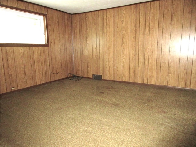 unfurnished room with wooden walls