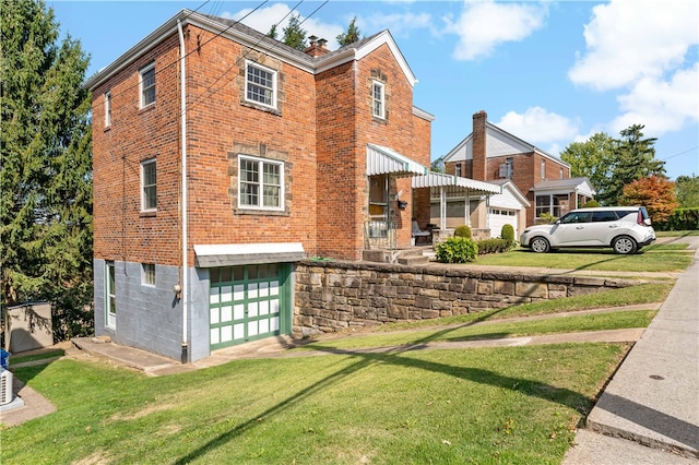 exterior space featuring a front yard and a garage