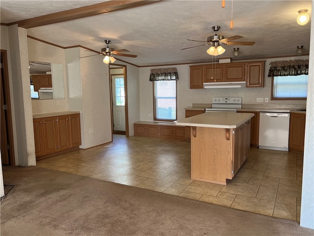 kitchen with electric stove, a kitchen island, light carpet, ceiling fan, and stainless steel dishwasher