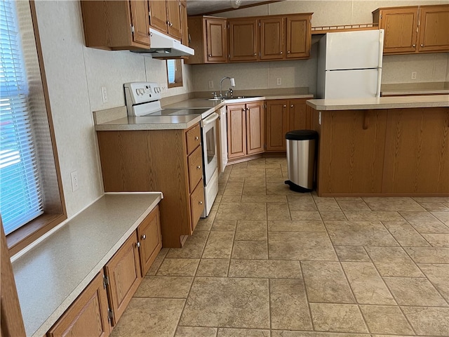 kitchen with sink and white appliances