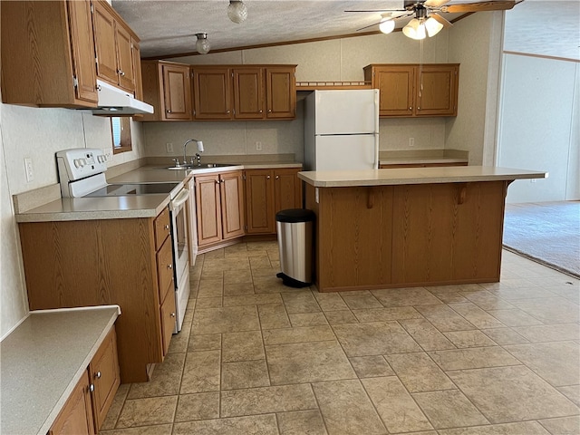 kitchen with a textured ceiling, sink, lofted ceiling, white appliances, and ceiling fan