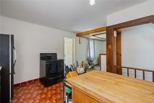 kitchen featuring black appliances and dark parquet floors