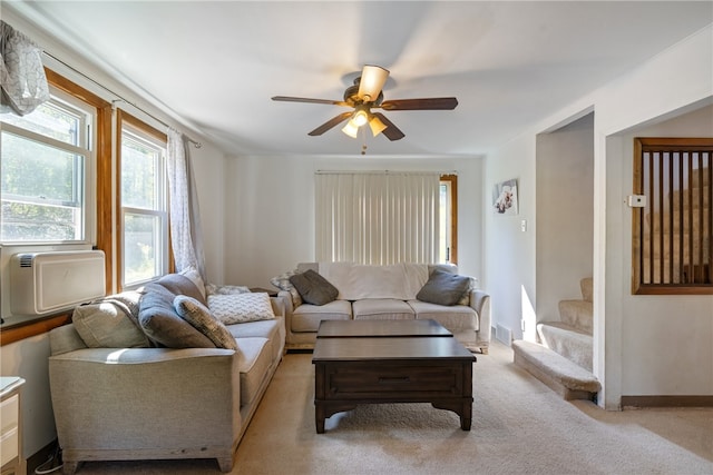 living room featuring light carpet and ceiling fan