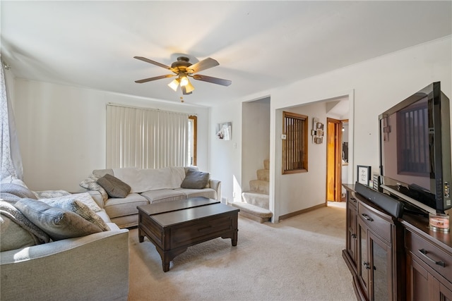 living room with ceiling fan and light colored carpet