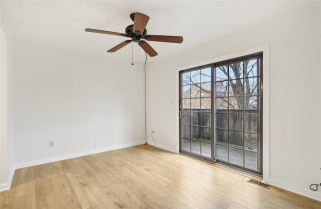 spare room with ceiling fan and light wood-type flooring