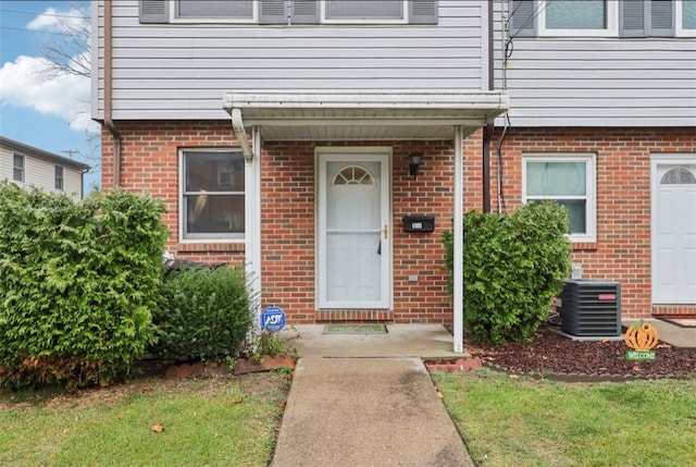 entrance to property featuring central AC