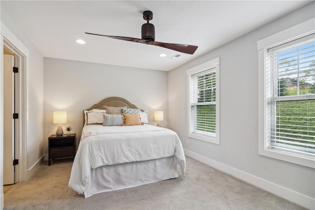 carpeted bedroom featuring ceiling fan