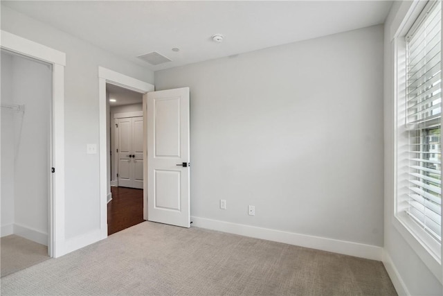 unfurnished bedroom with carpet flooring