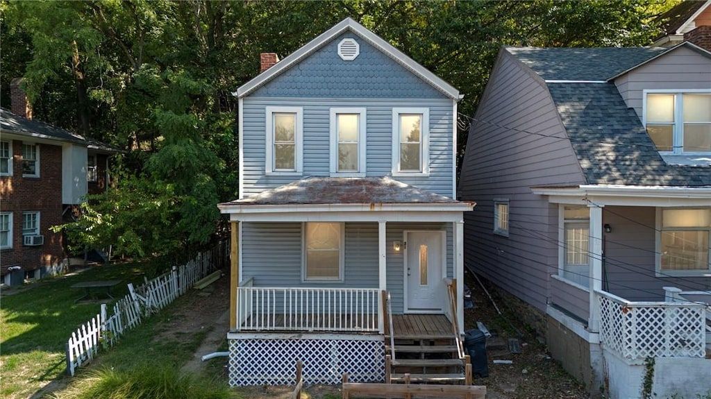 view of front of home featuring a porch and cooling unit