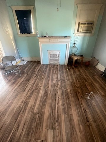 unfurnished living room featuring hardwood / wood-style flooring