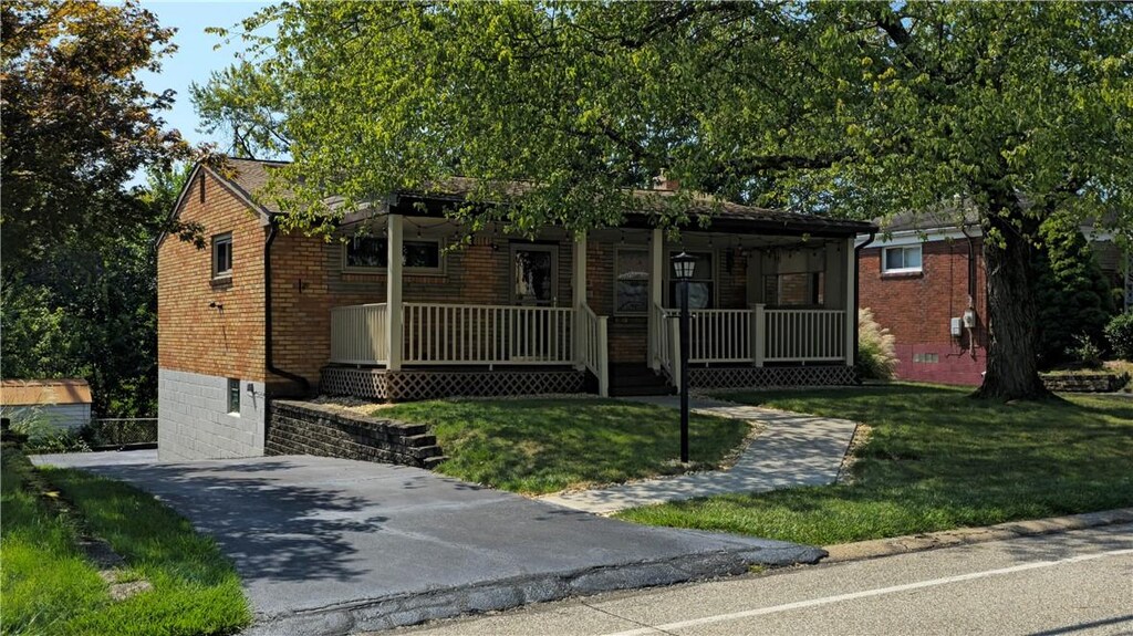 625 Highridge Dr, Baldwin Twp, PA 15226 - single story home featuring a front lawn, brick siding, and covered porch
