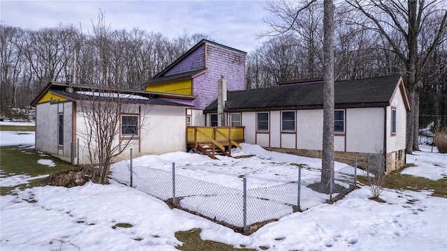 view of snow covered house