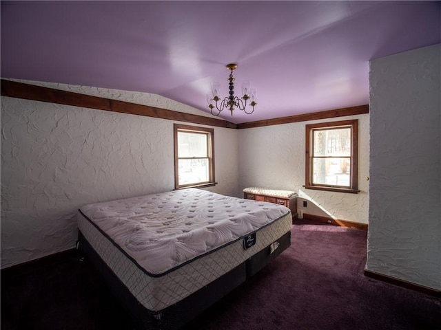 carpeted bedroom with lofted ceiling and an inviting chandelier