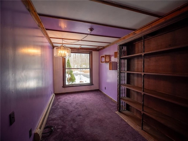 carpeted spare room featuring a baseboard radiator and a notable chandelier