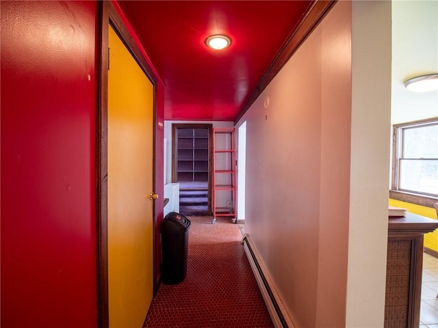 hall with crown molding, a baseboard radiator, and light colored carpet