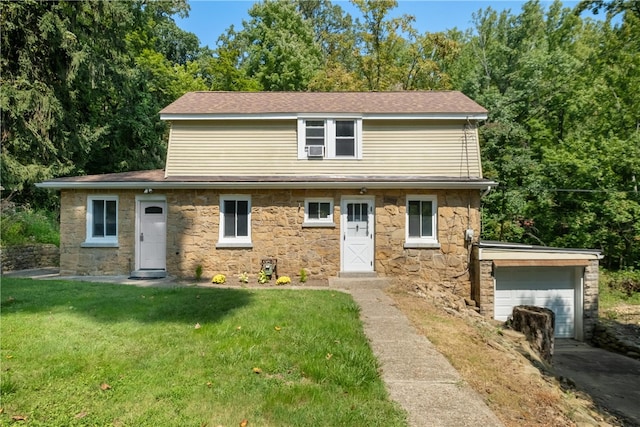 view of front of home with a garage and a front lawn