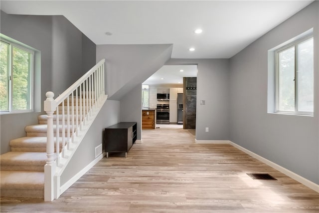 interior space featuring hardwood / wood-style floors and a wealth of natural light