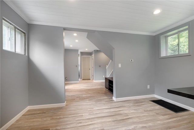 interior space featuring light wood-type flooring and ornamental molding