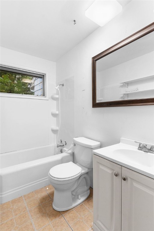 full bathroom with tile patterned flooring, washtub / shower combination, vanity, and toilet