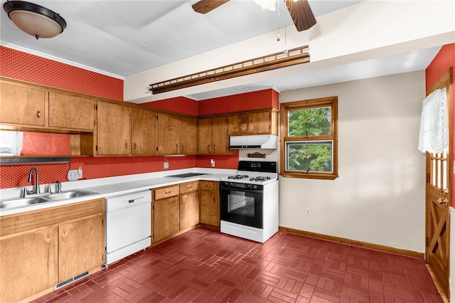 kitchen featuring white appliances, sink, and ceiling fan