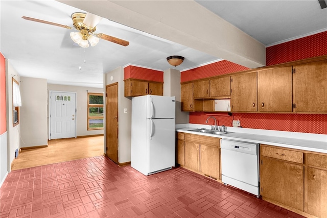 kitchen featuring ceiling fan, sink, and white appliances