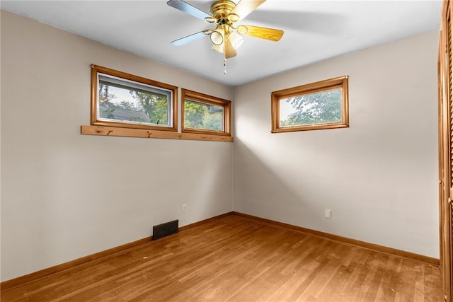 spare room with ceiling fan and light hardwood / wood-style flooring