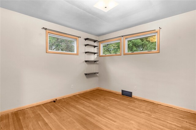 spare room featuring light hardwood / wood-style flooring