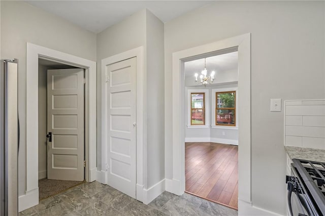 interior space featuring a chandelier and hardwood / wood-style flooring