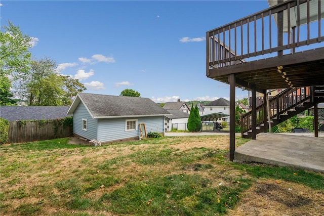 view of yard with a patio and a wooden deck