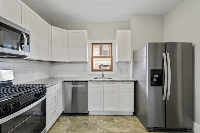 kitchen with white cabinetry, sink, and appliances with stainless steel finishes