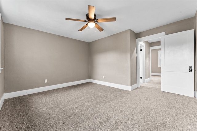 carpeted empty room with ceiling fan