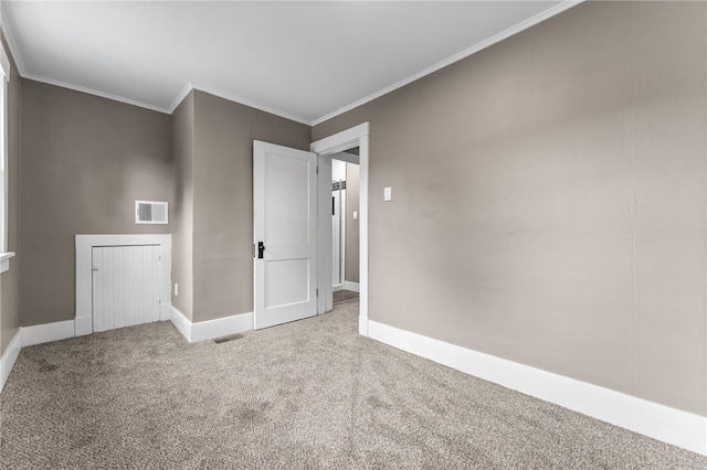 carpeted spare room with ornamental molding