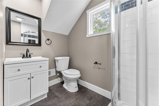 bathroom with vaulted ceiling, an enclosed shower, vanity, and toilet