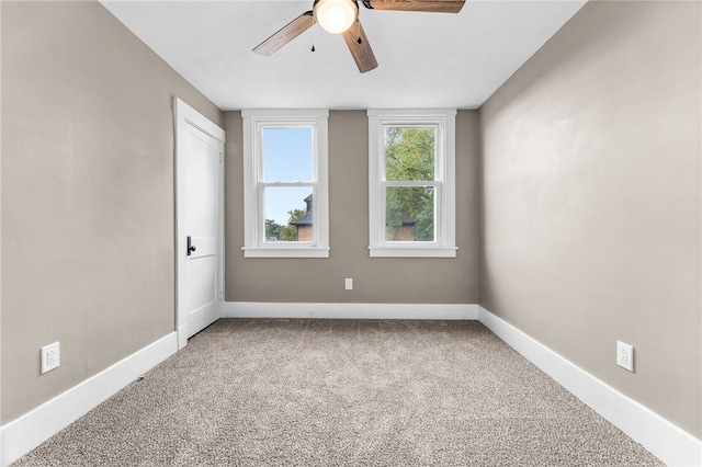 spare room with ceiling fan and carpet flooring