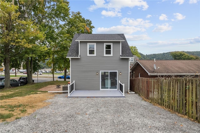 back of property with a patio area