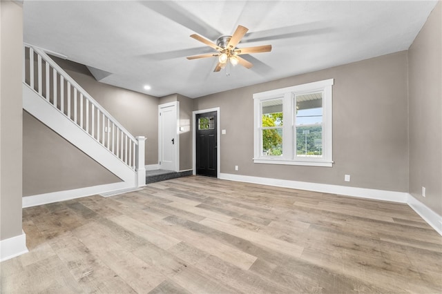 entrance foyer with ceiling fan and light hardwood / wood-style flooring