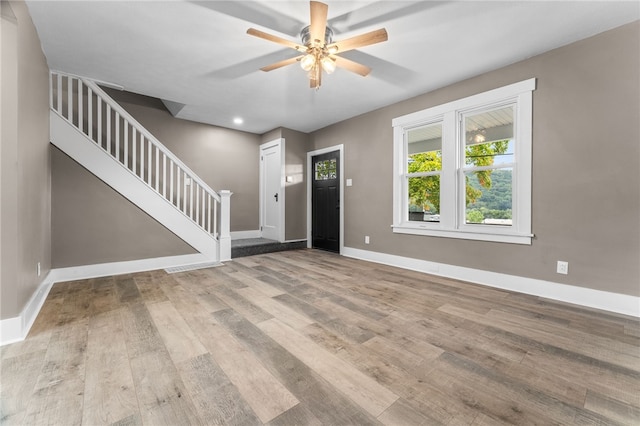 foyer with light hardwood / wood-style flooring and ceiling fan