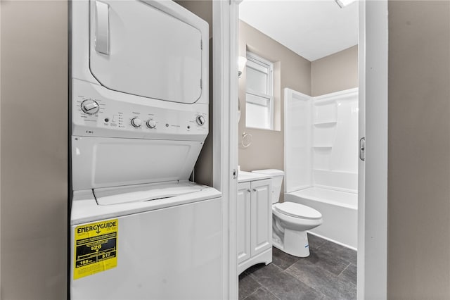 washroom with stacked washer and dryer