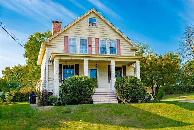 view of front of house with a front lawn and a porch