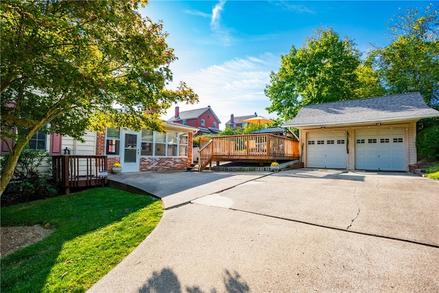 view of front of property with a deck and a front lawn